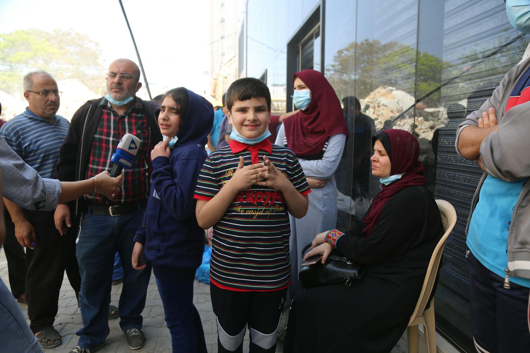 Group Of People Including Children Engaged In